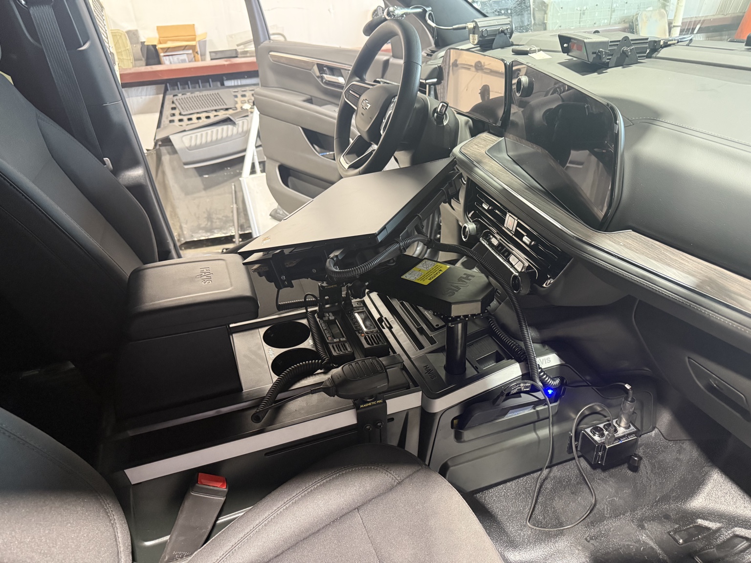 Completed public safety vehicle interior with Havis console laptop mount radios and control equipment